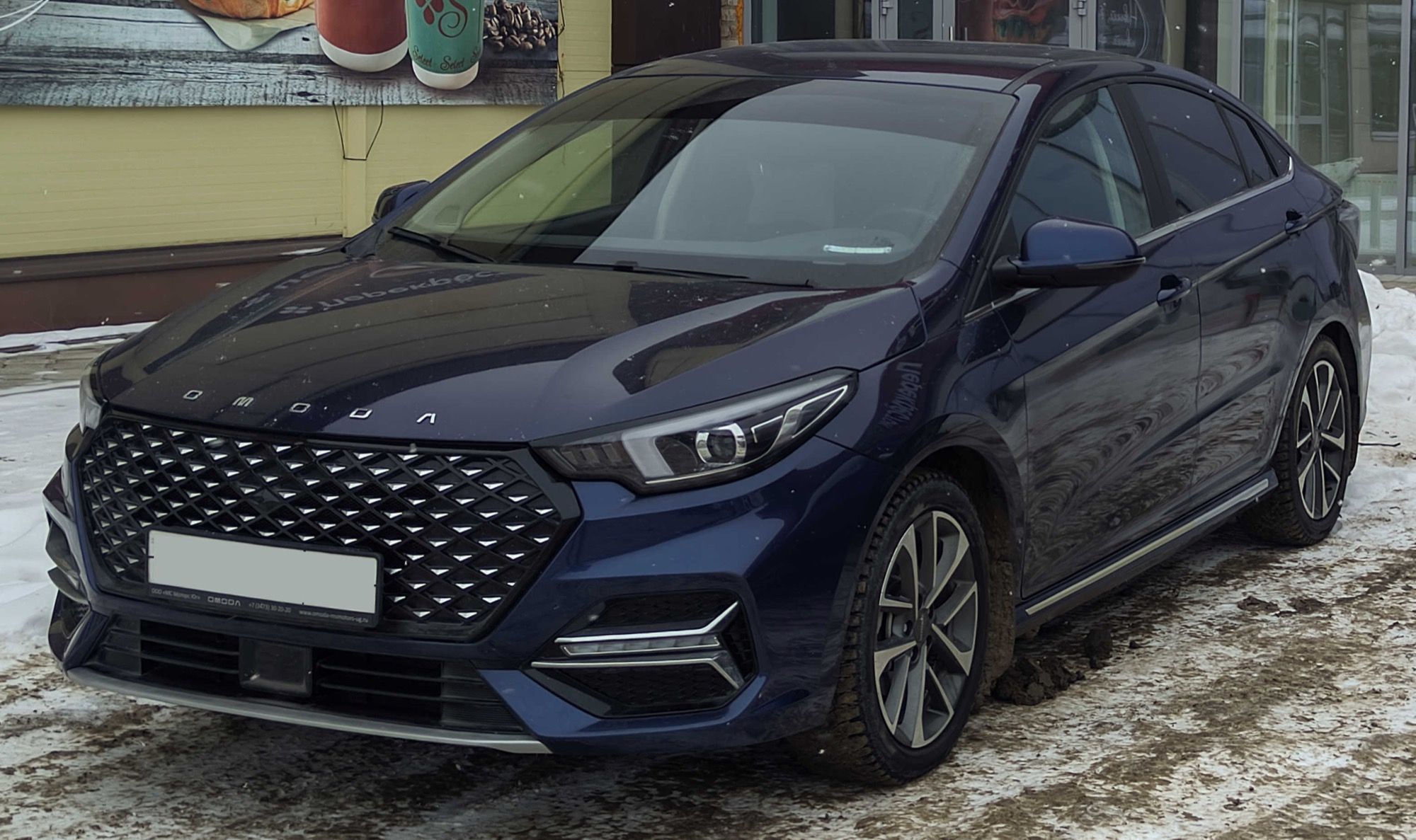 Dark blue 2023 Omoda S5 sedan, front three-quarter view