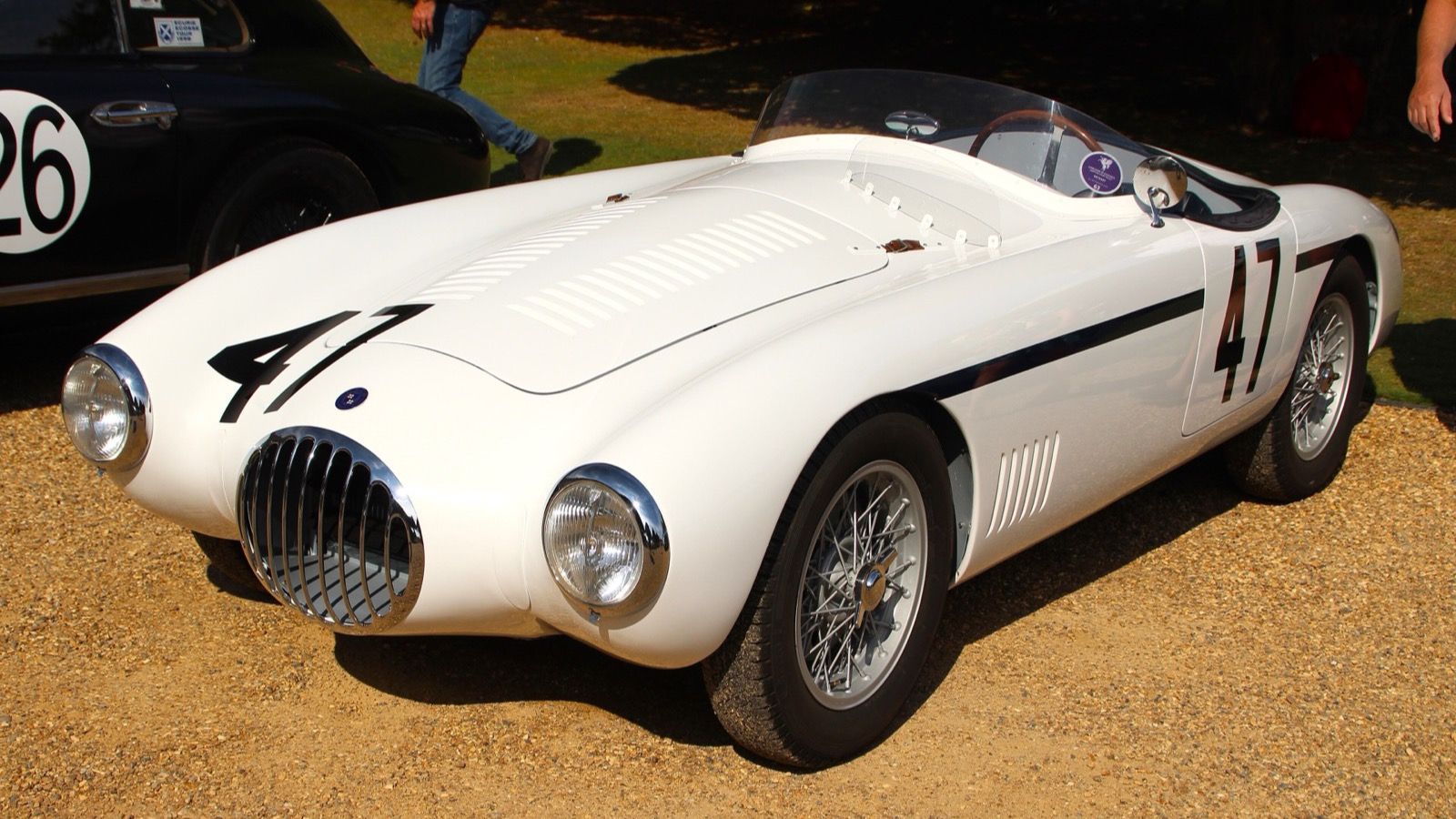 White 1953 OSCA MT4 barchetta racing number 47, front left three-quarter view