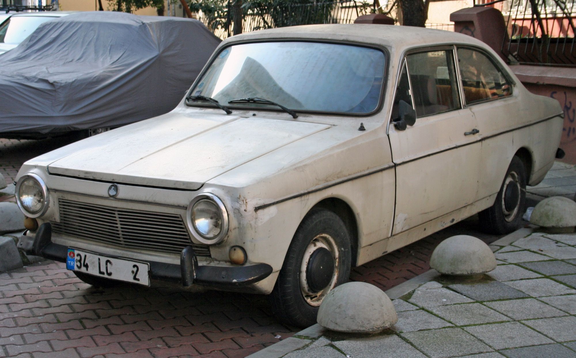 Light grey Anadol A1 two-door fiberglass compact, front three-quarter view