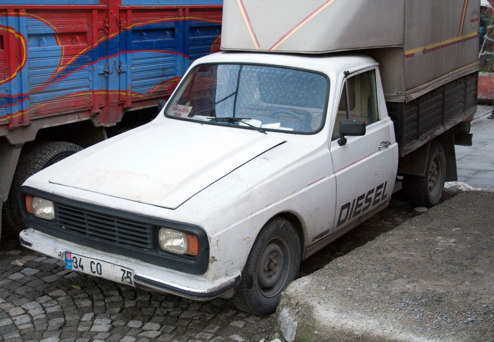 White Otosan P2 600D diesel pickup truck, front three-quarter view