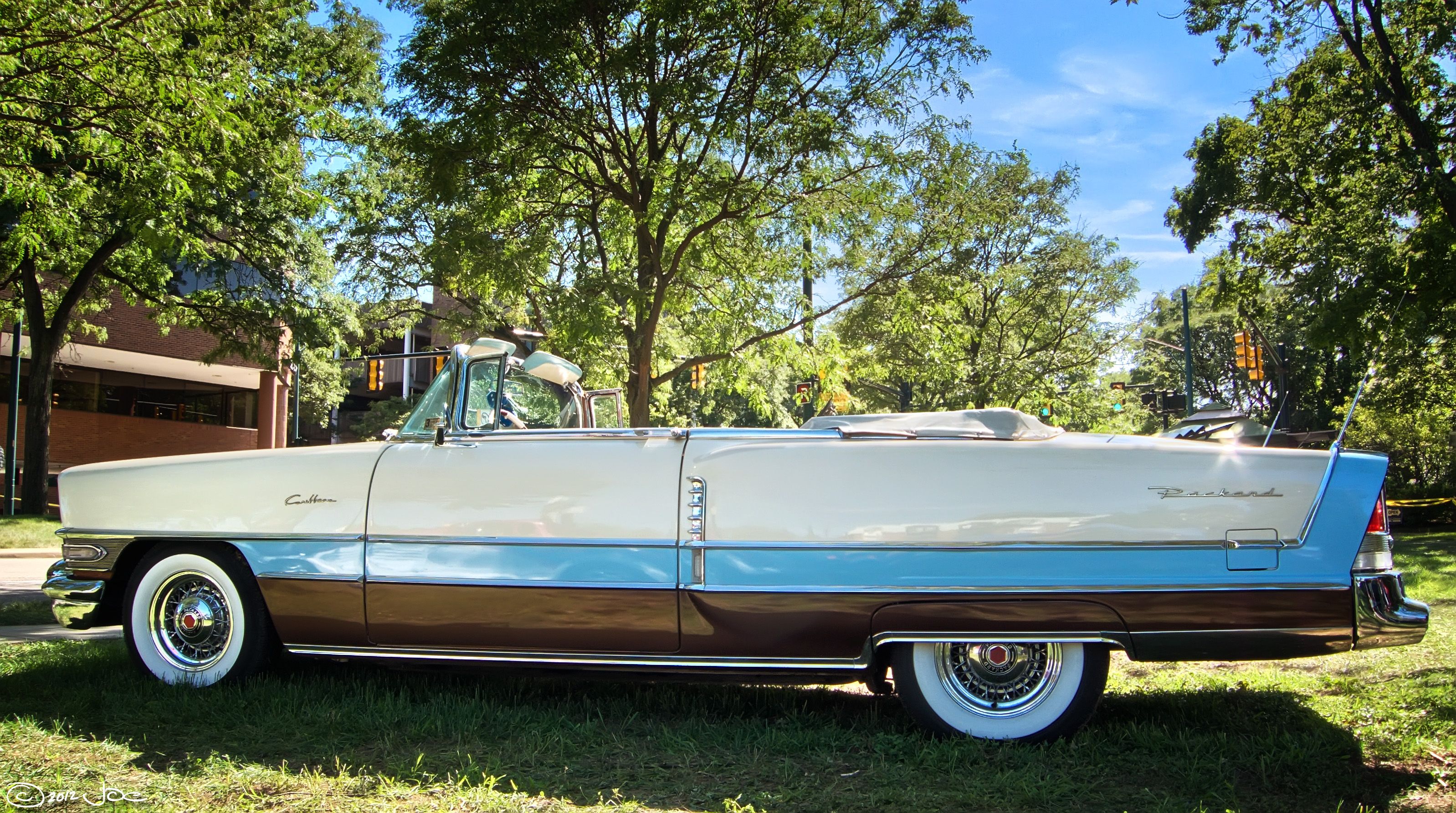 White, blue and brown tri-tone 1956 Packard Caribbean convertible, side profile