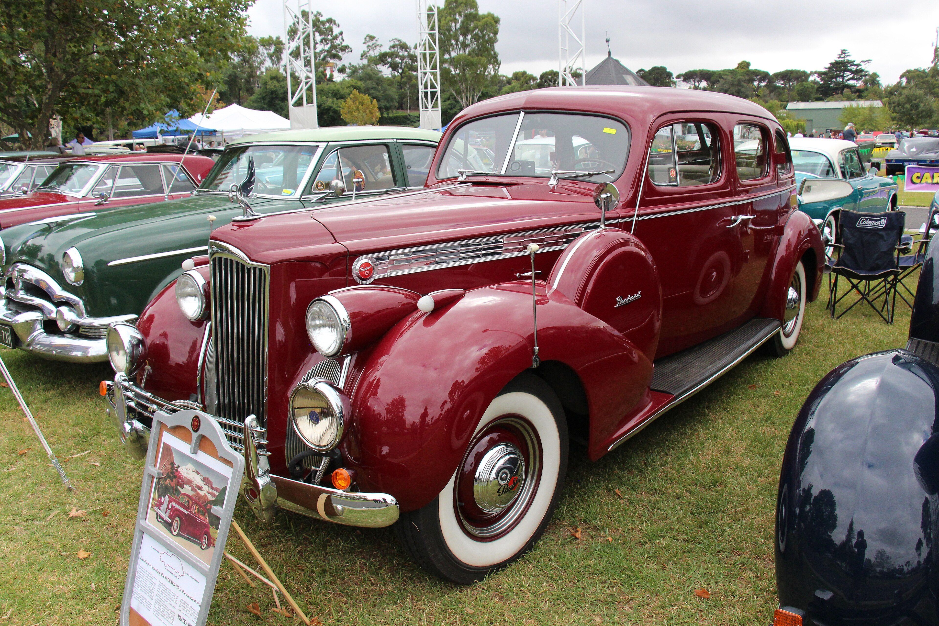 Maroon 1940 Packard 1801 One-Twenty Club Sedan, front three-quarter view