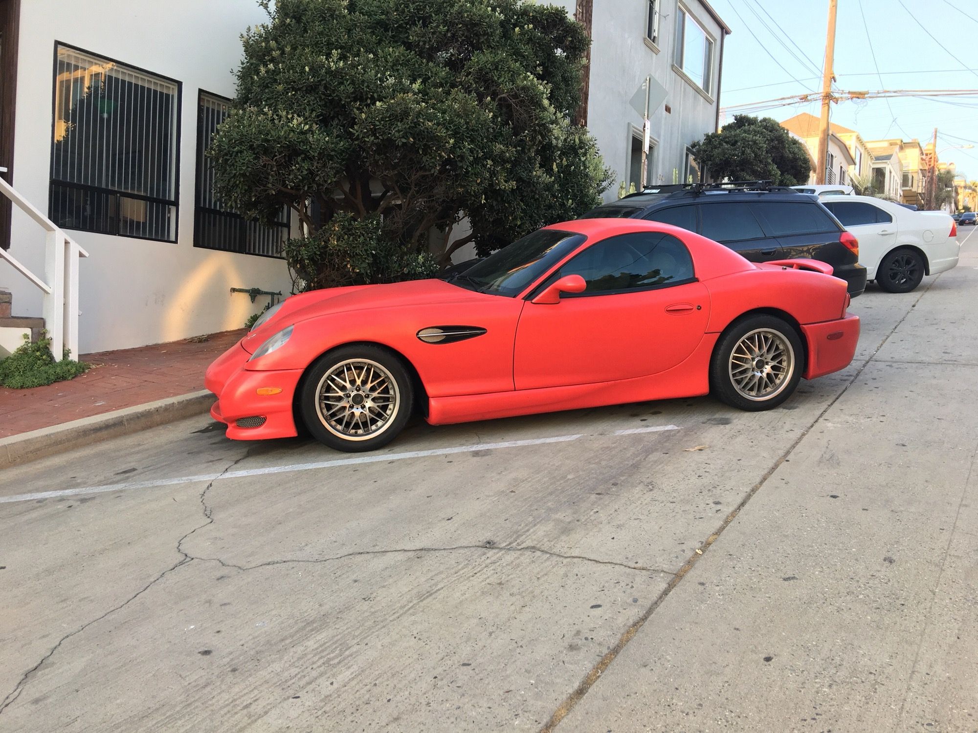 Red 2007 Panoz Esperante GTLM coupe, side profile