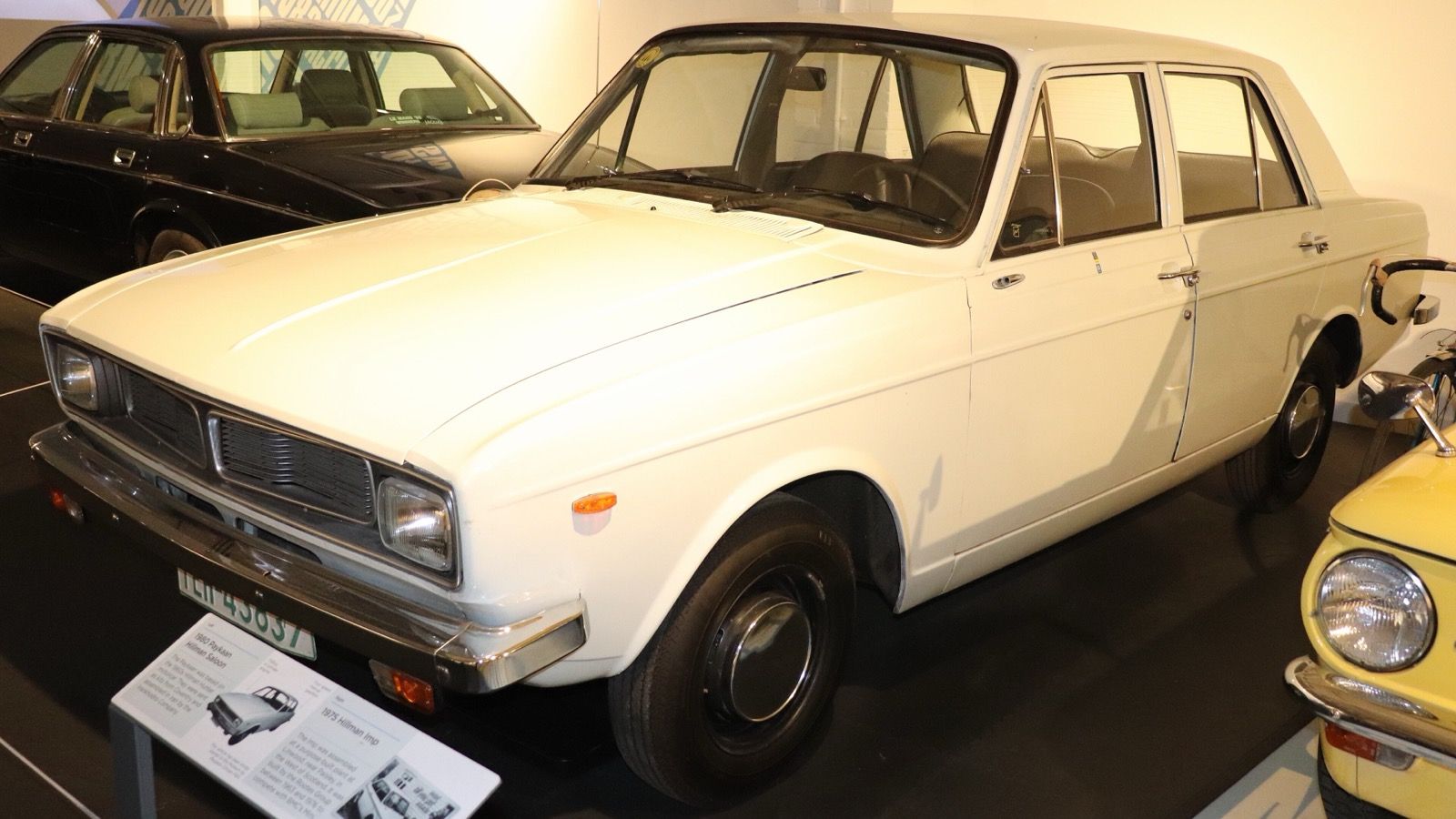 White 1980 Paykan saloon on museum display, front three-quarter view
