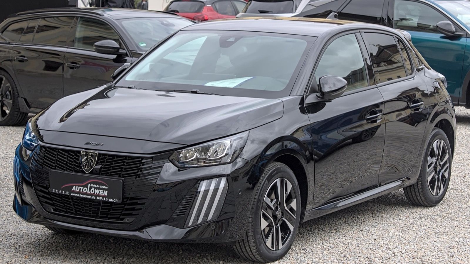 Black facelifted 2024 Peugeot 208 hatchback, front three-quarter view