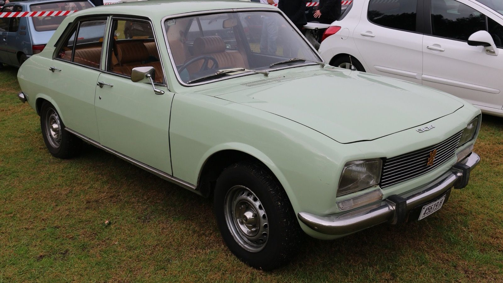 Pale green Peugeot 504 four-door saloon, front three-quarter view