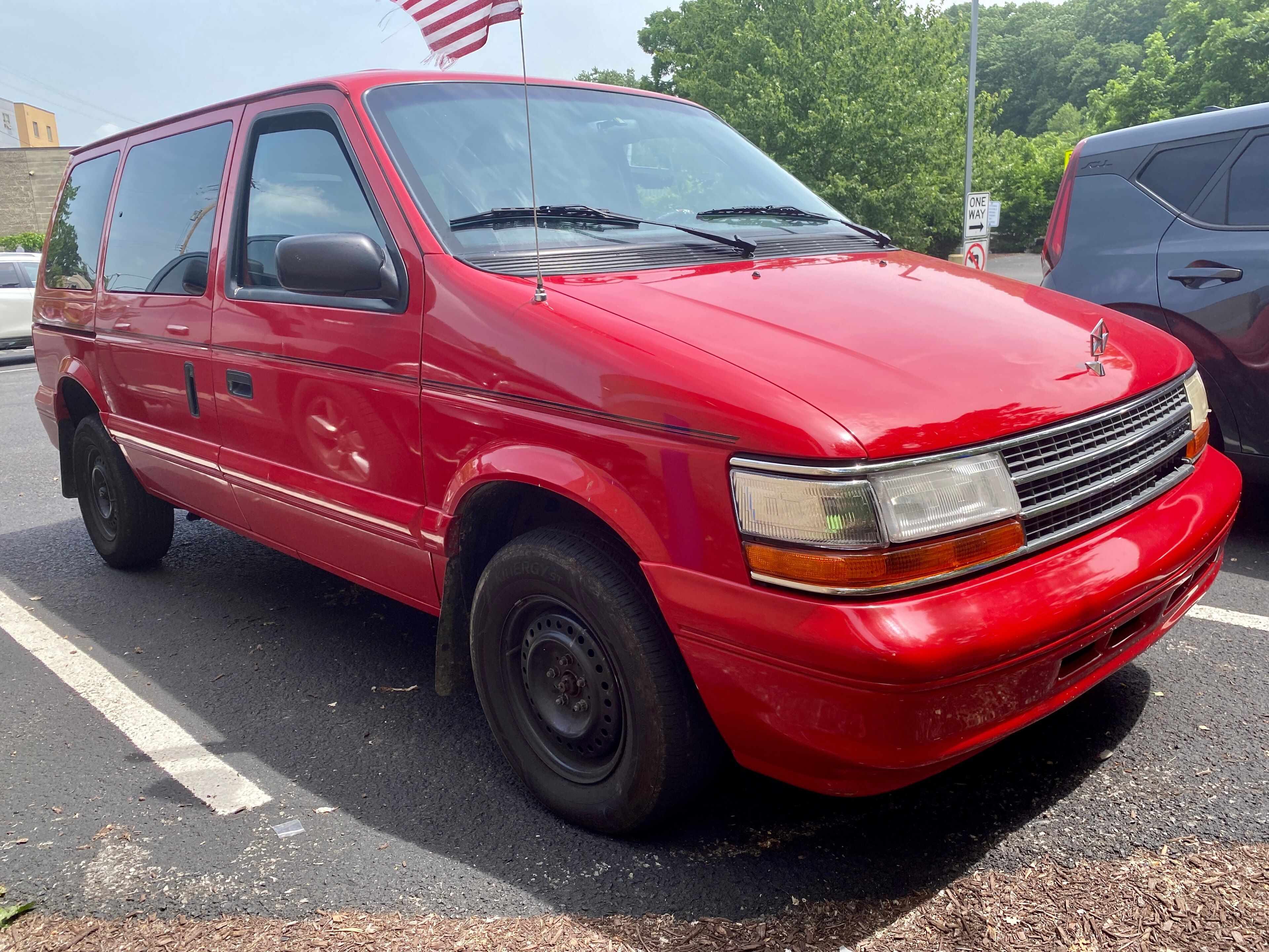 1994 Plymouth Voyager in red, front three-quarter view