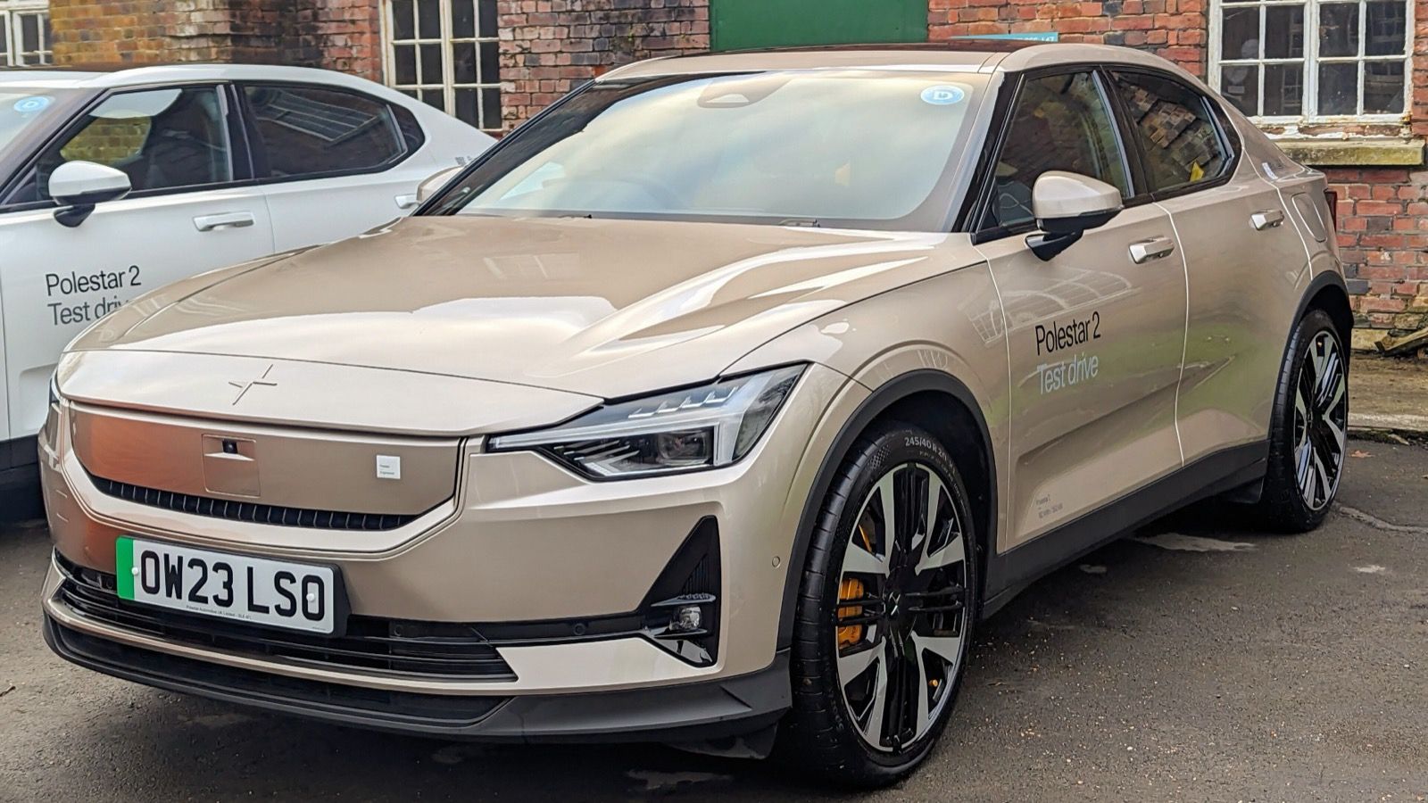 Gold 2023 Polestar 2 Pilot Plus AWD demonstrator, front three-quarter view