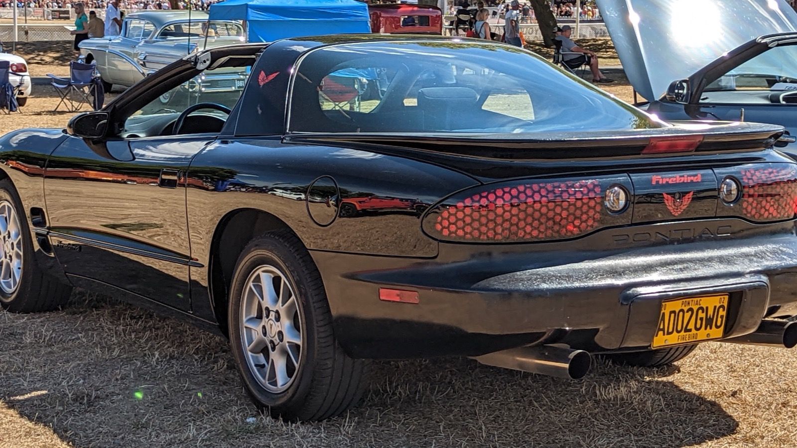 2002 Pontiac Firebird 3.8L V6, fourth generation — black coupe, rear three-quarter view