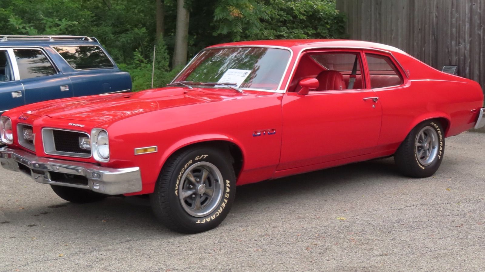 1974 Pontiac GTO coupe in red, front three-quarter view