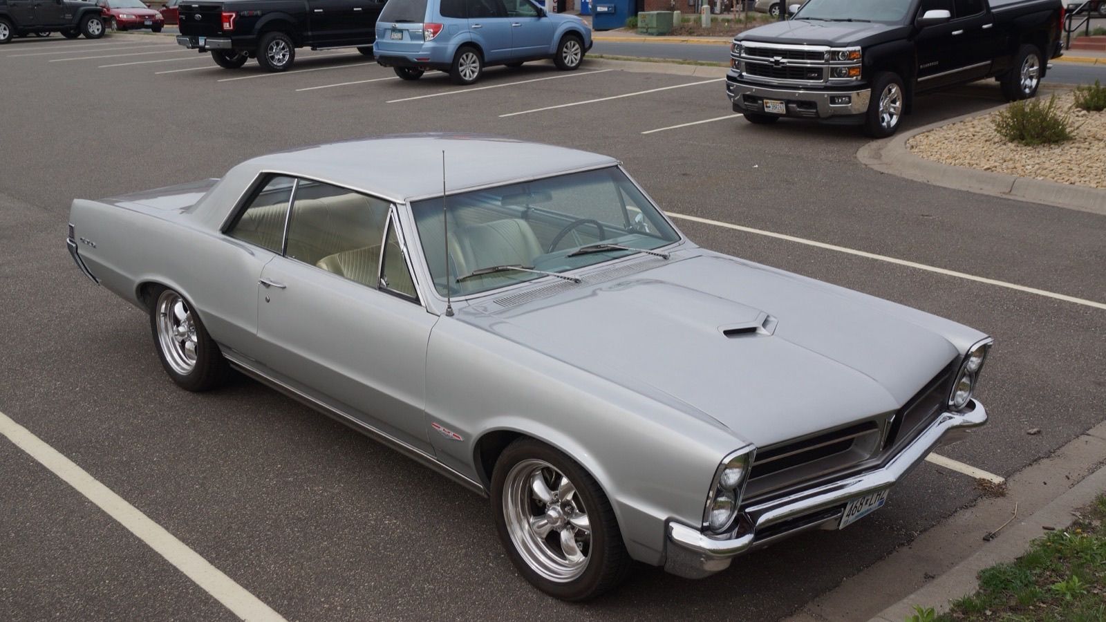1965 Pontiac GTO hardtop coupe in silver, front three-quarter view