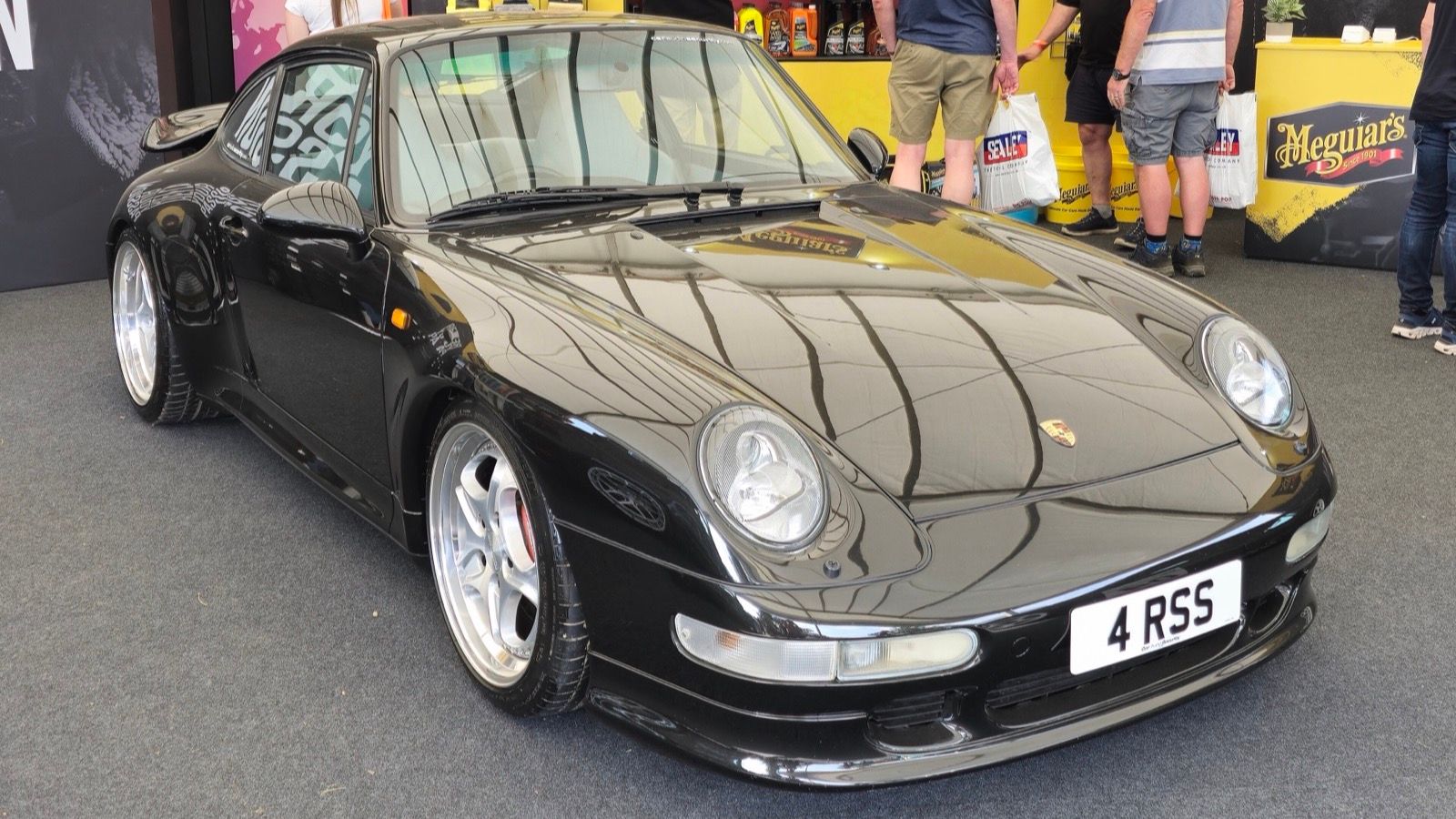 Black 1995 Porsche 911 (993) Turbo coupe, front three-quarter view