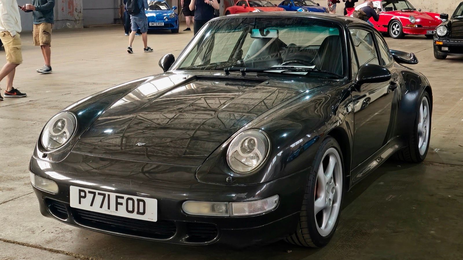 Dark 1997 Porsche 911 (993) Turbo coupe, front three-quarter view