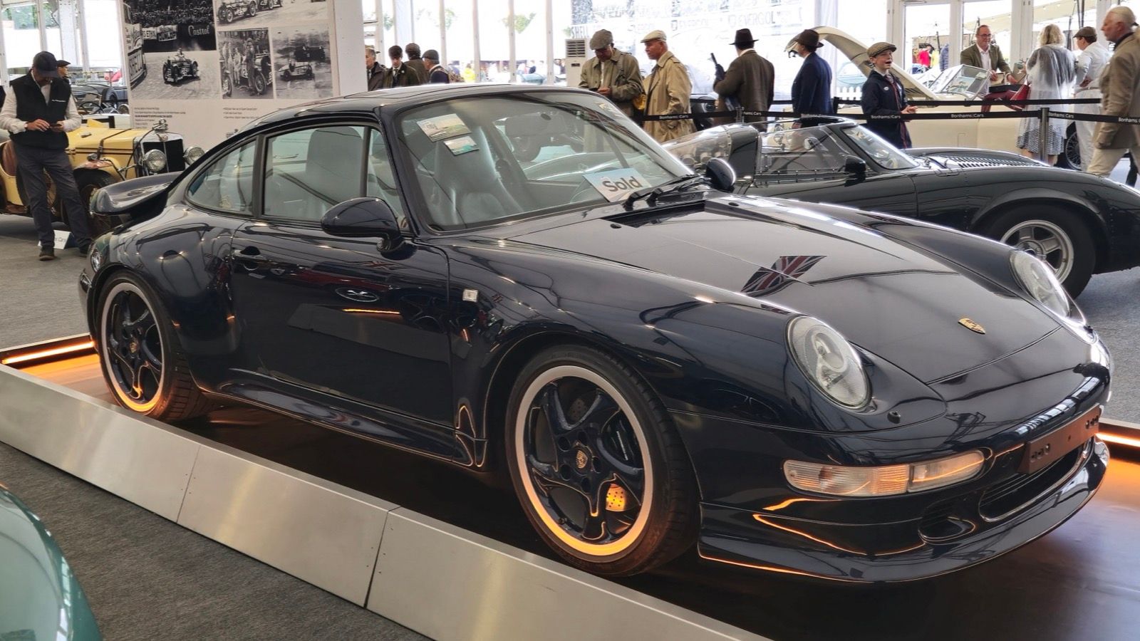 Dark blue 1998 Porsche 911 (993) Turbo coupe on display, front three-quarter view