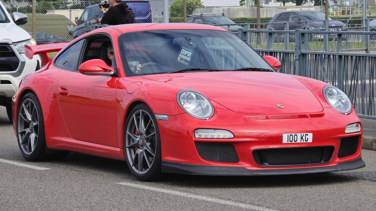 Red 2009 Porsche 911 (997) GT3 coupe, front three-quarter view