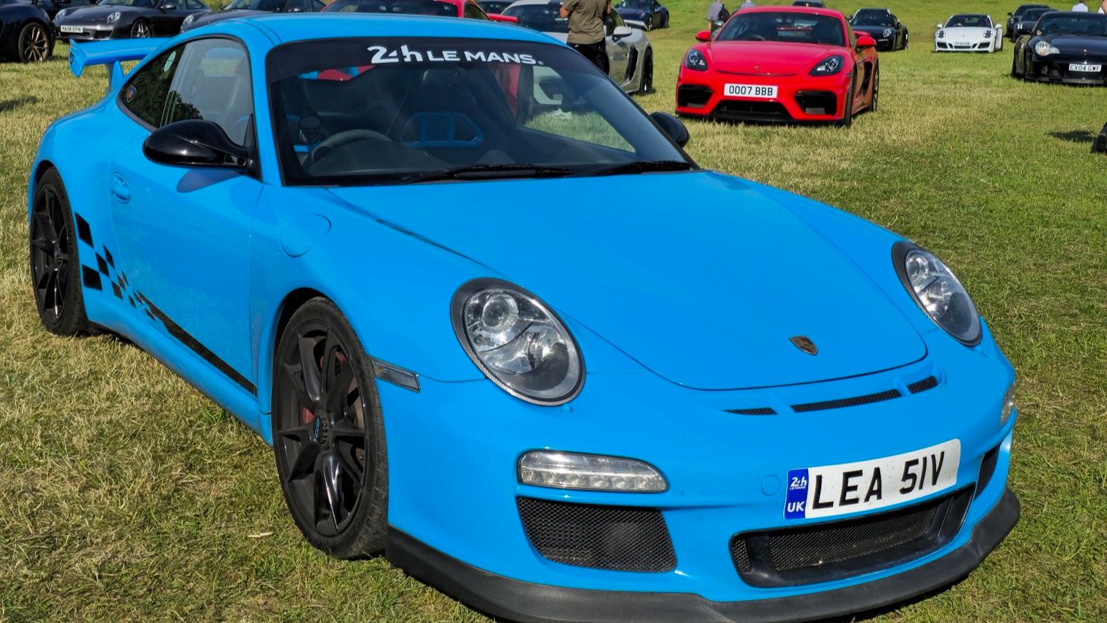 Light blue 2010 Porsche 911 (997) GT3 coupe, front three-quarter view