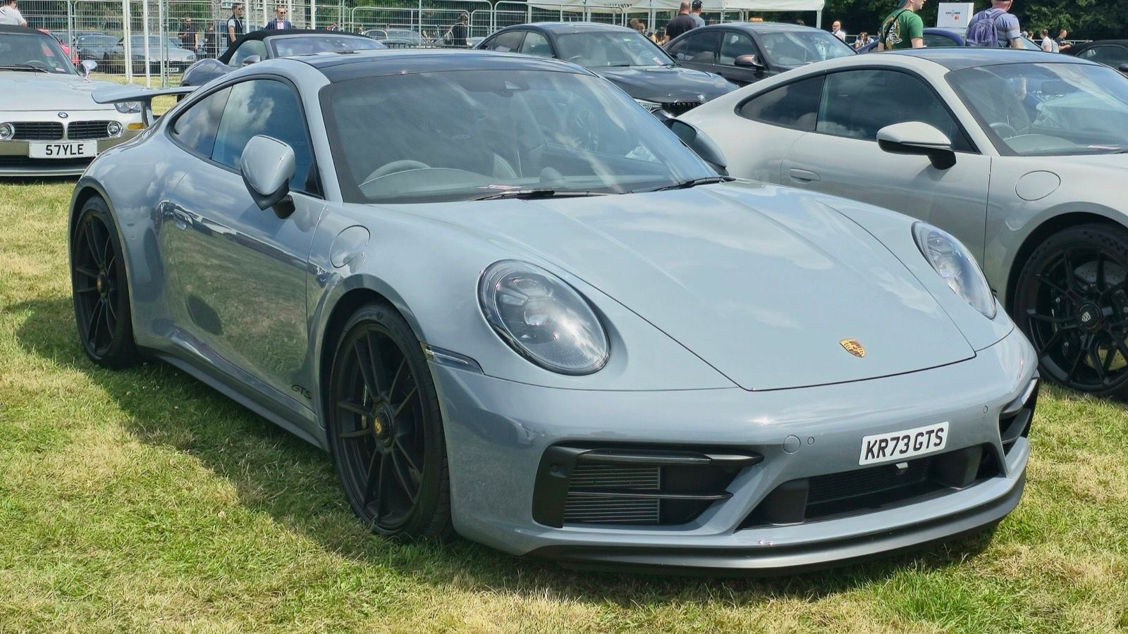 Grey 2023 Porsche 911 (992) Carrera GTS coupe, front three-quarter view