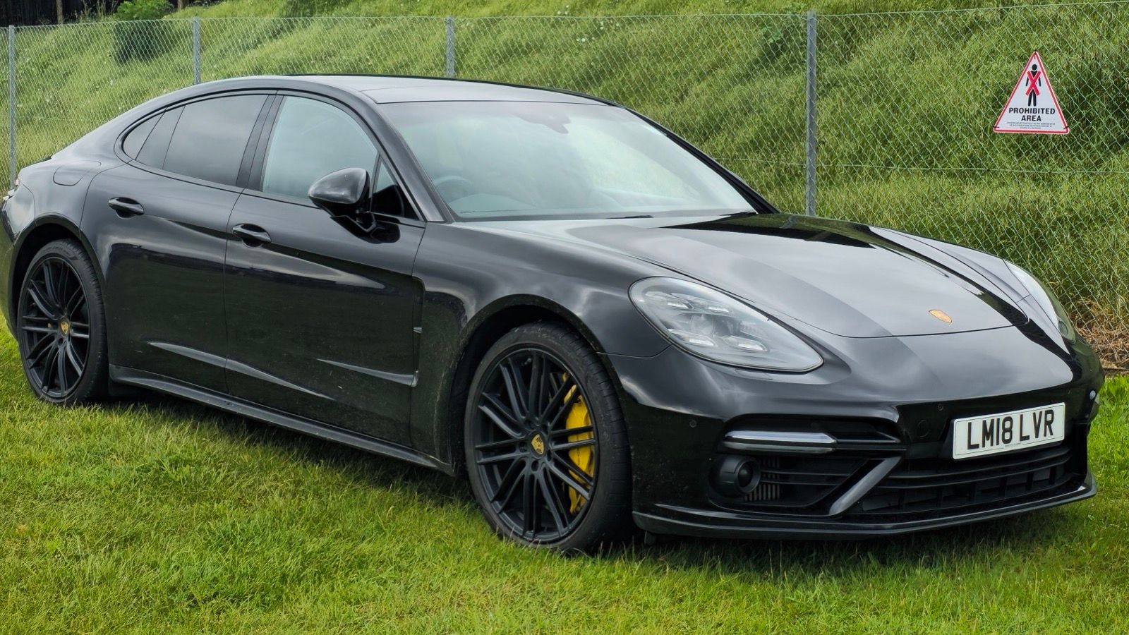 Black 2018 Porsche Panamera, front three-quarter view