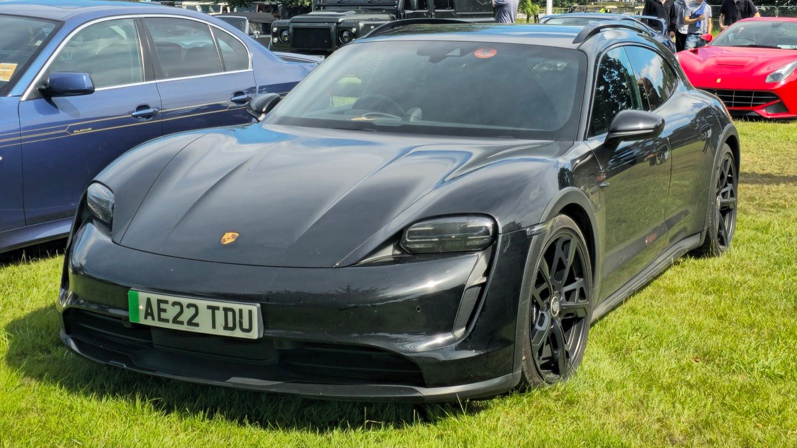 Black 2022 Porsche Taycan 4S Cross Turismo, front three-quarter view