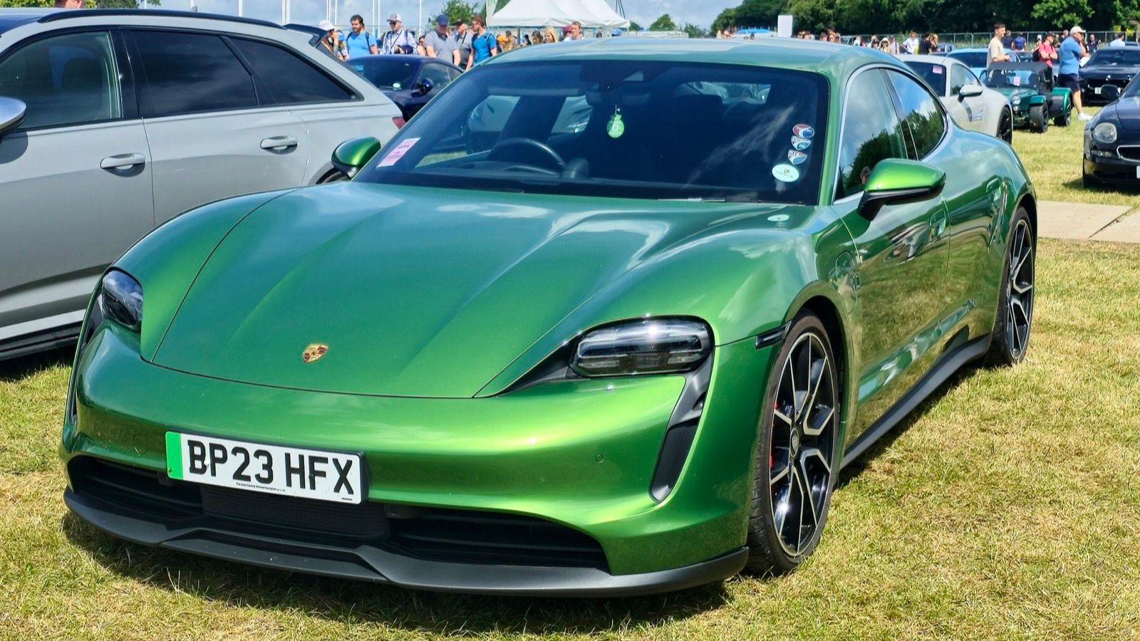 Green 2023 Porsche Taycan 4S, front three-quarter view