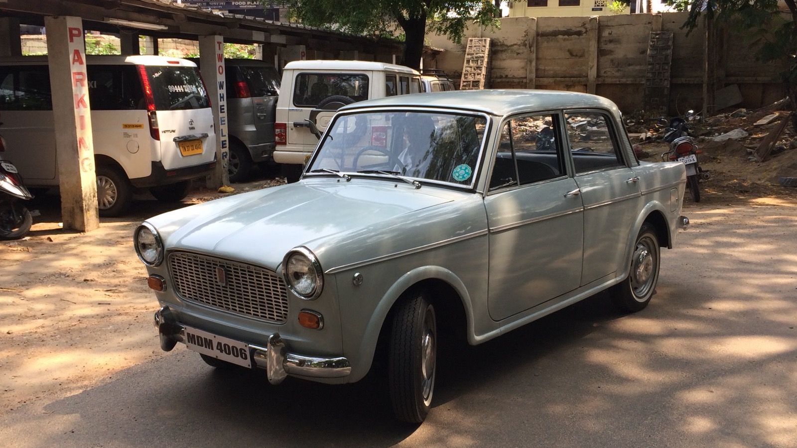 Pale green 1969 PAL-Fiat 1100D saloon, front three-quarter view