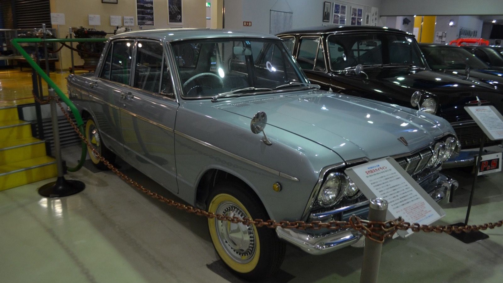 White Prince S50D-1 Skyline 1500 Deluxe second-generation sedan on museum display, front three-quarter view