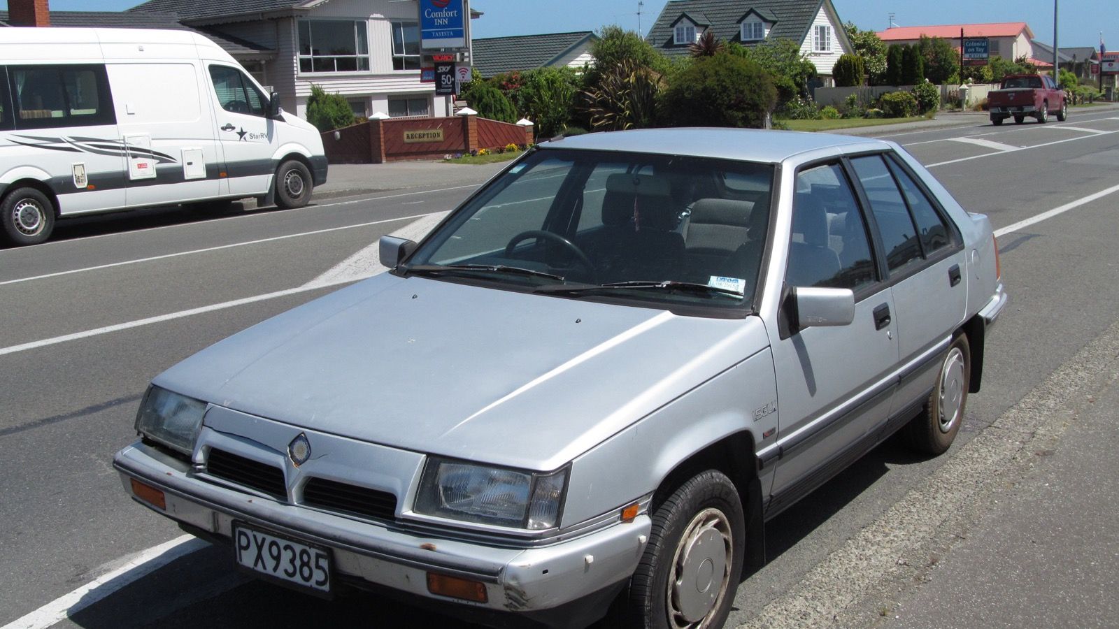 Silver 1991 Proton Saga GLX Aeroback five-door hatchback, front three-quarter view