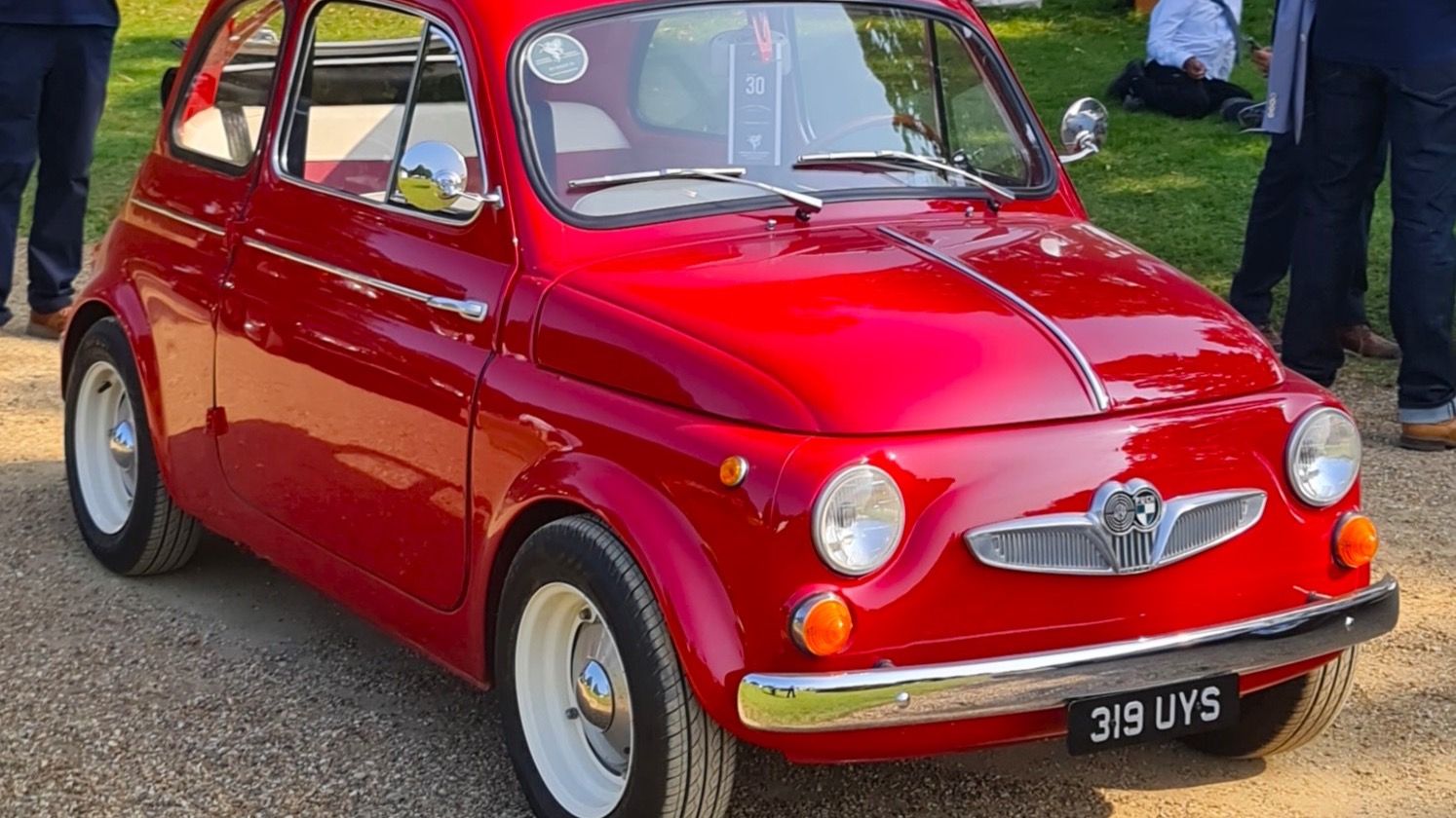 Red 1962 Puch 500 D at a car show, front three-quarter view