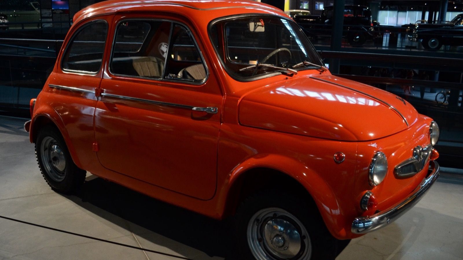 Orange Puch 500 D on museum display, front three-quarter view