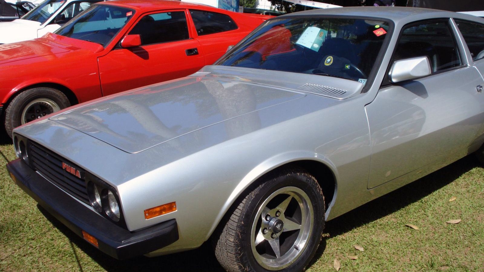 Silver Puma GTB S2 fastback coupe, front three-quarter view showing the quad headlights and PUMA grille badge