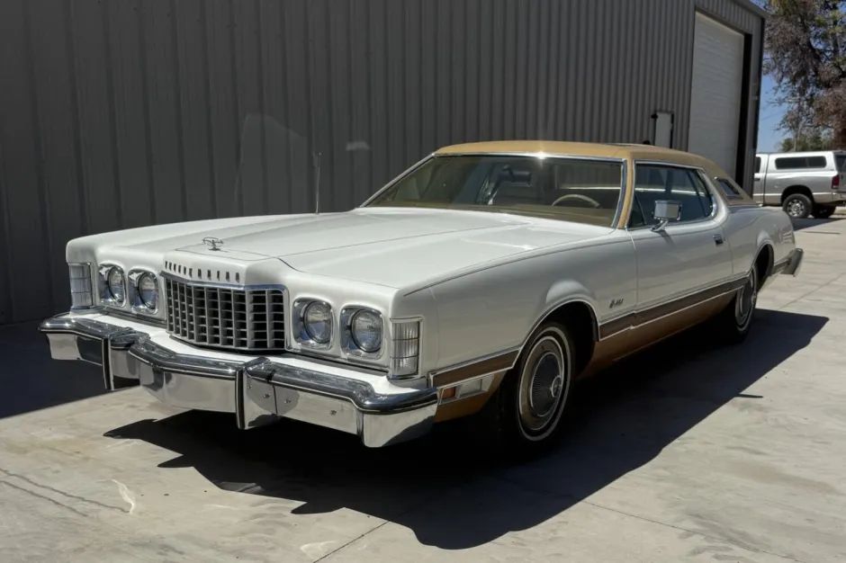 1974 Ford Thunderbird, white two-door coupe with gold roof, front three-quarter view