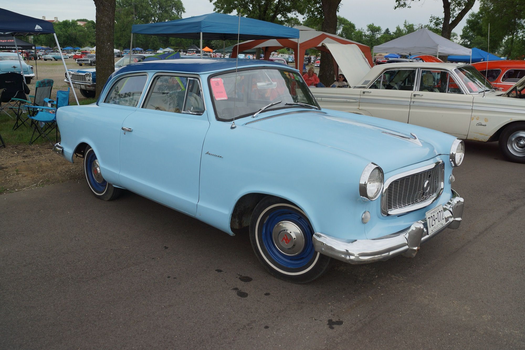 Light blue 1959 Rambler American two-door sedan, front three-quarter view