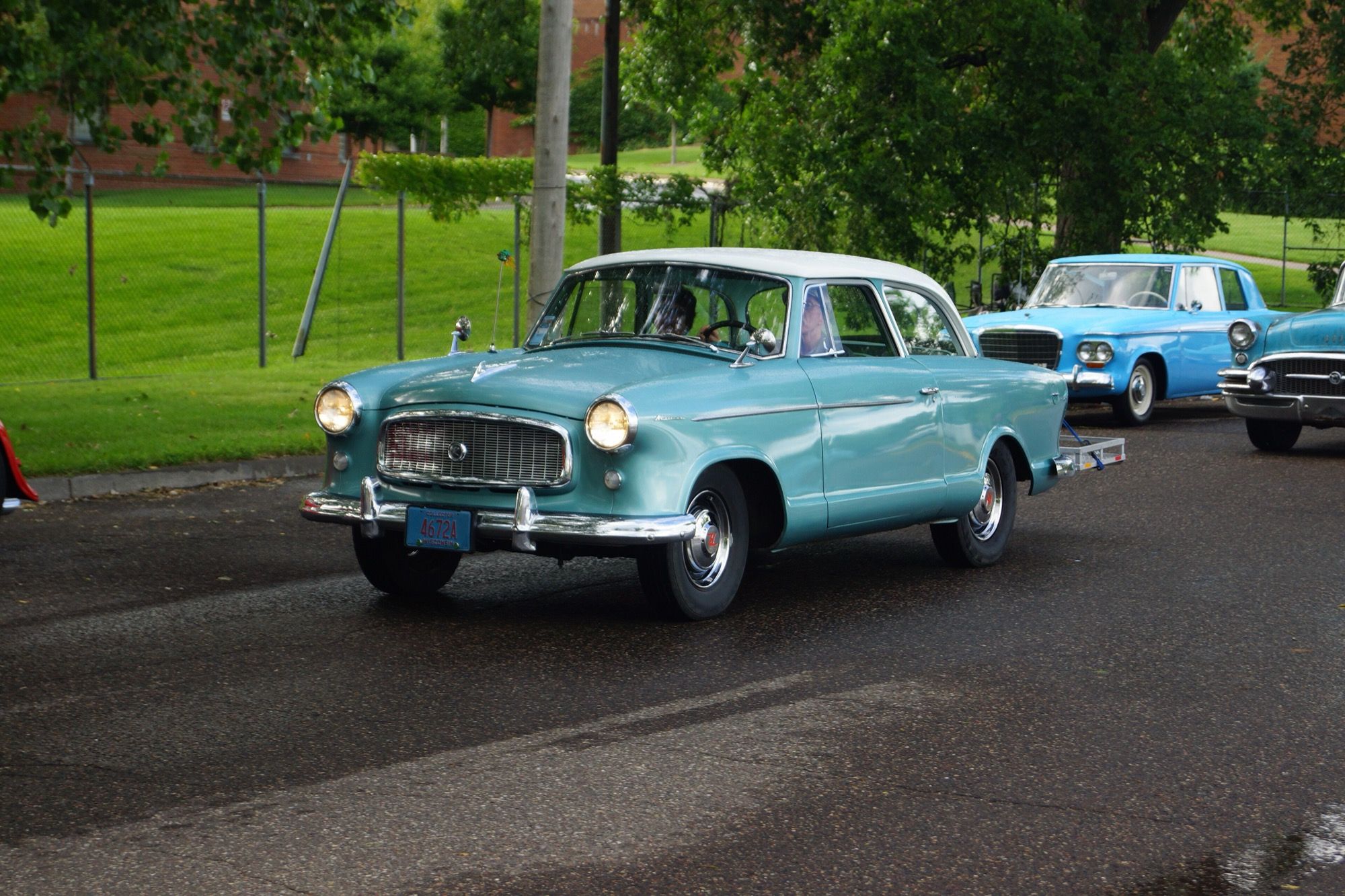 Turquoise 1960 Rambler American two-door sedan with white roof, front three-quarter view
