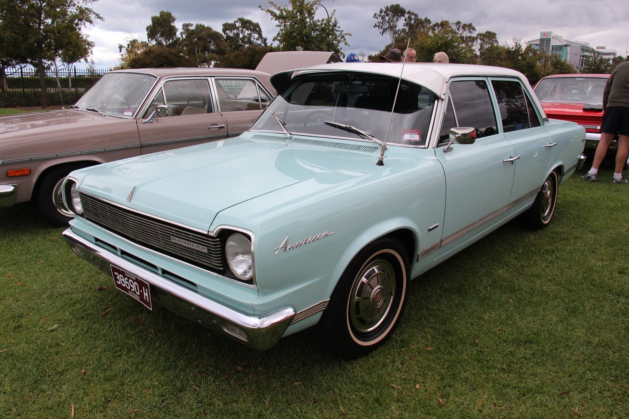 Pale blue 1966 Rambler American four-door sedan with white roof, front three-quarter view