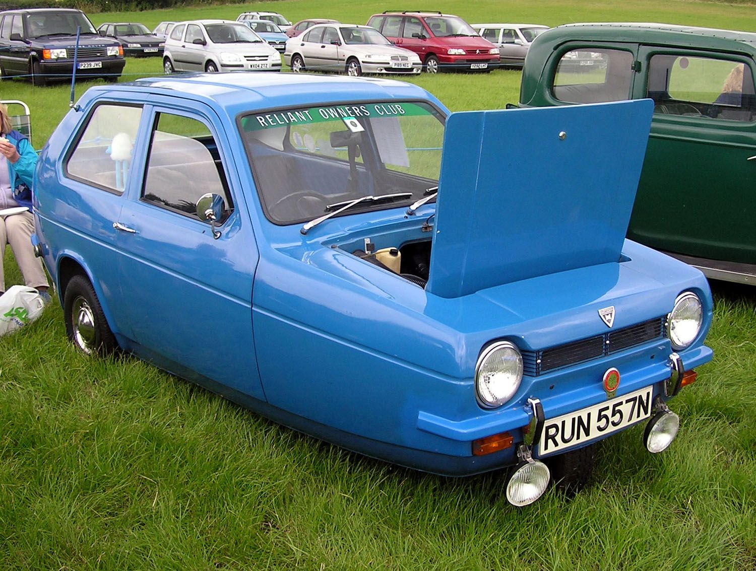 Blue 1974 Reliant Robin saloon with bonnet raised, front three-quarter view