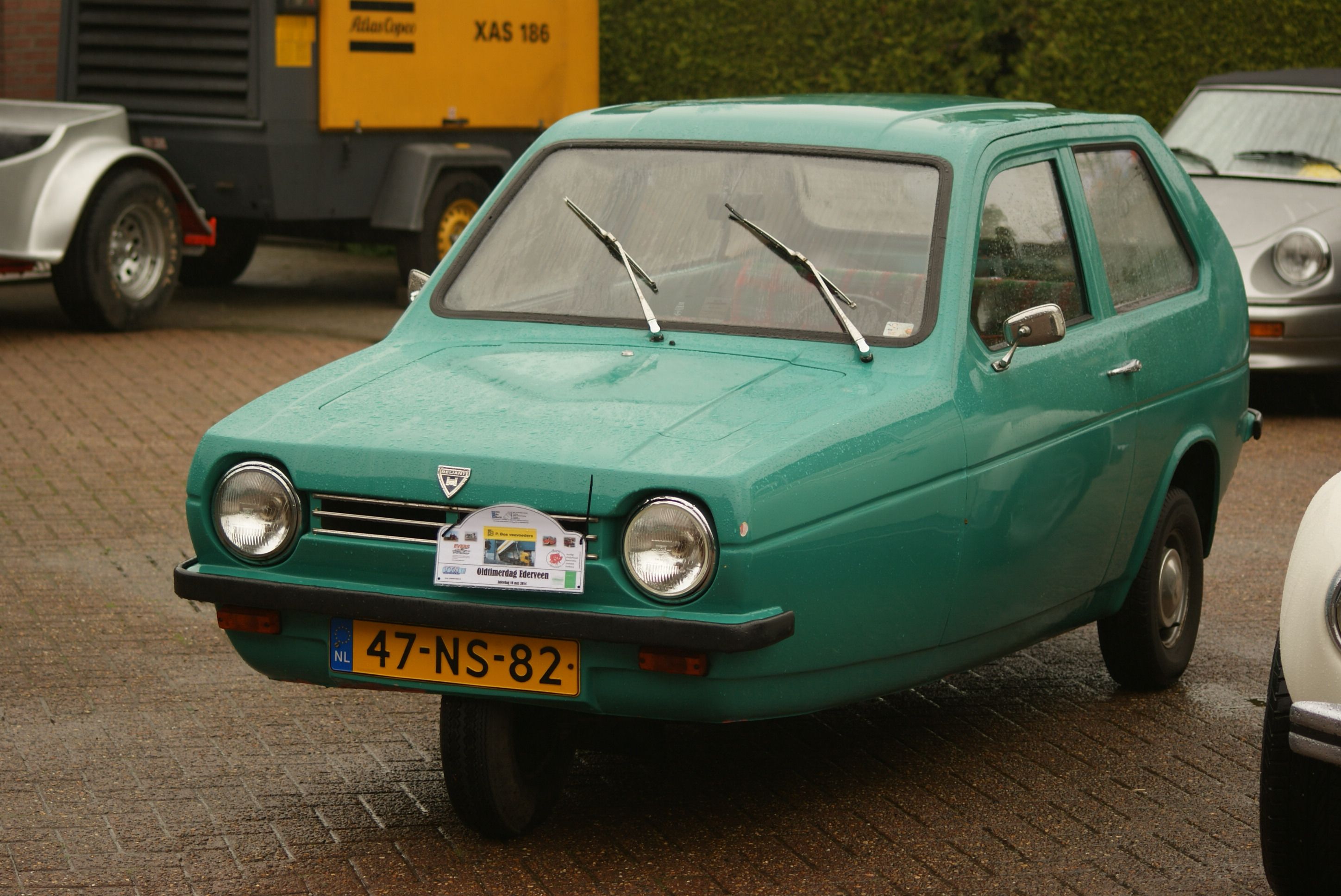 Green 1977 Reliant Robin 850 three-wheeler, front three-quarter view