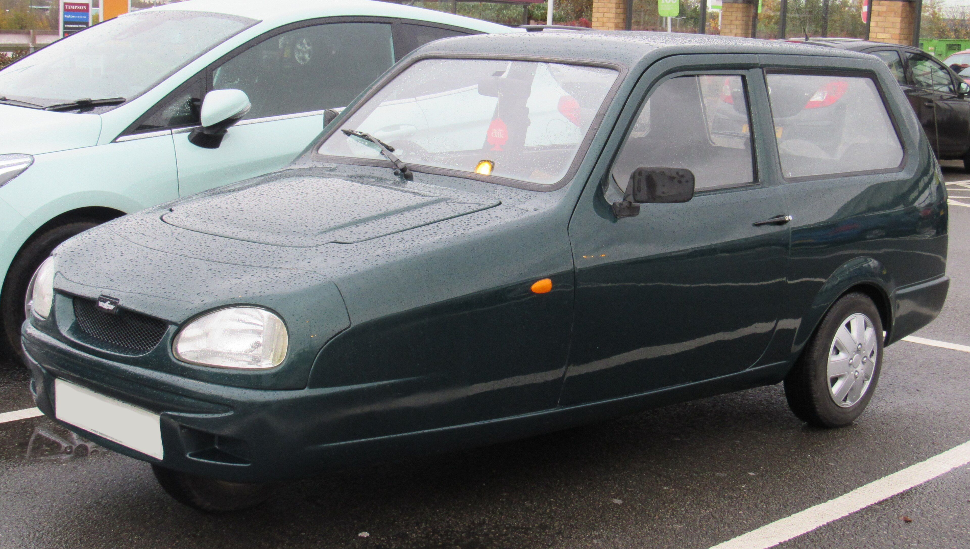Dark green 2001 Reliant Robin SLX three-wheeler, front three-quarter view