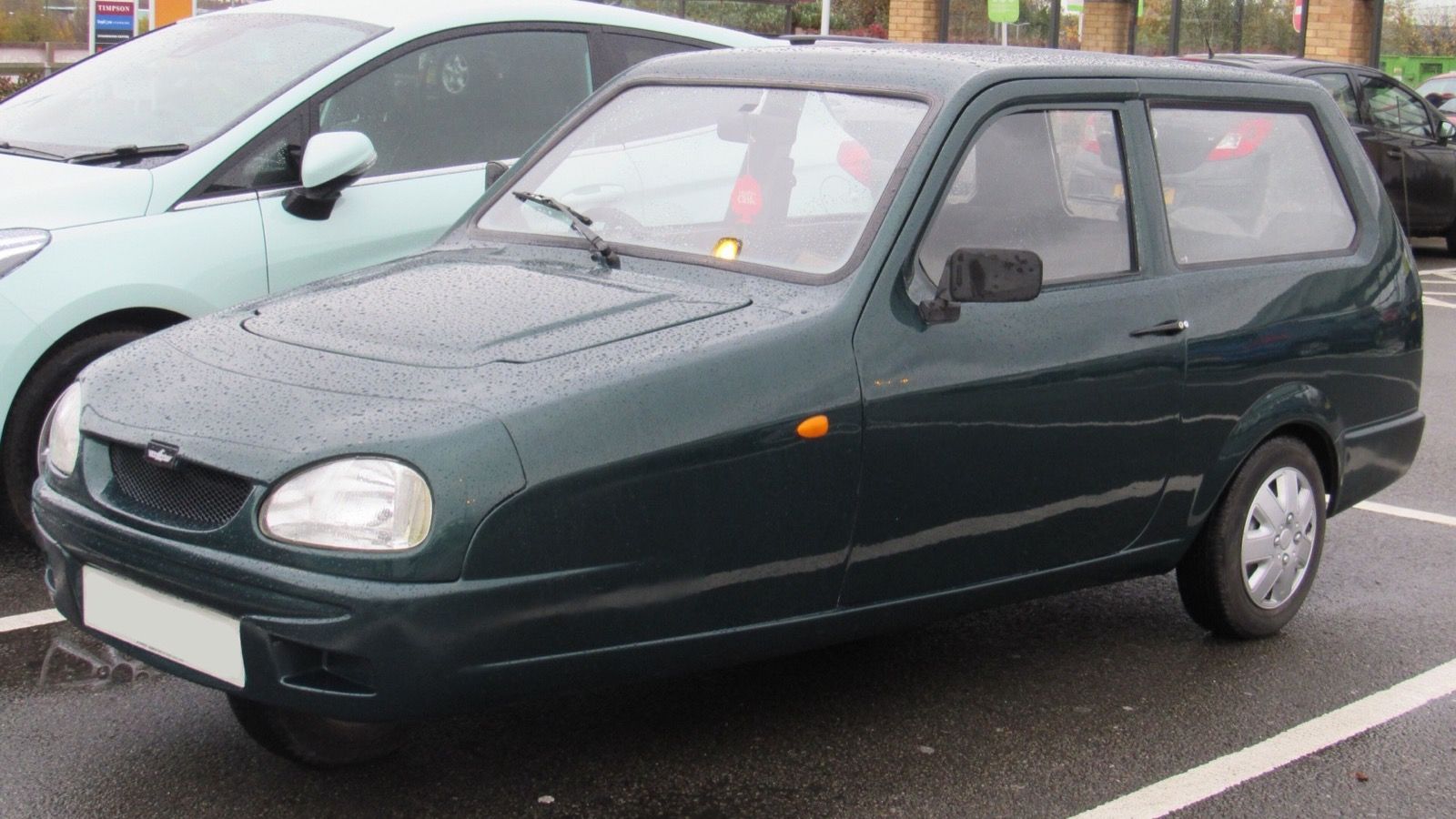 Dark green 2001 Reliant Robin SLX three-wheeler, front three-quarter view