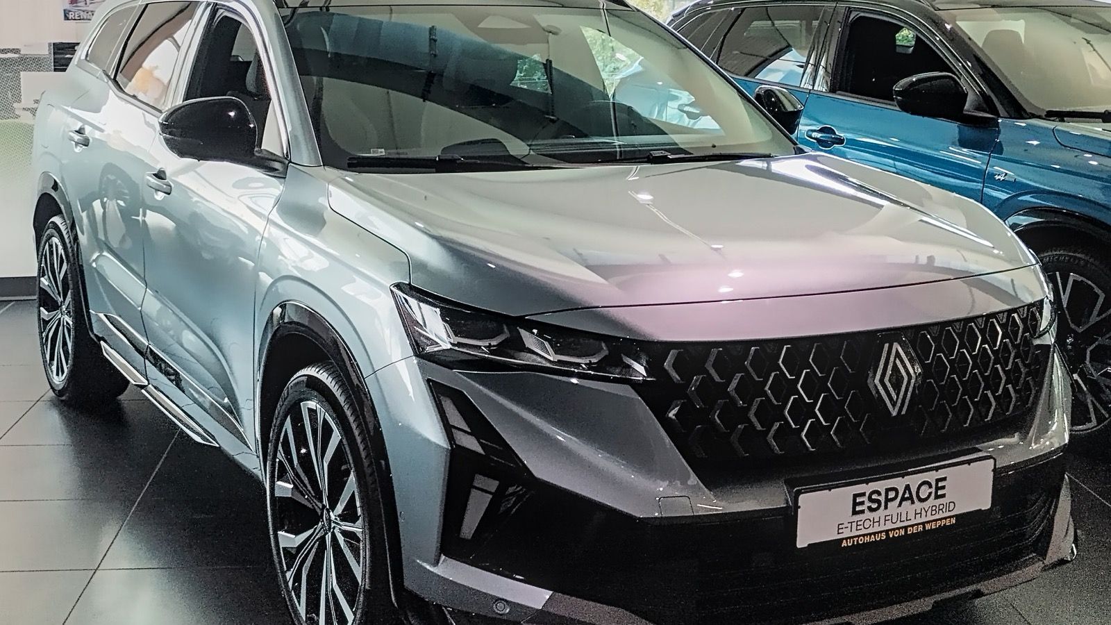 White 2025 sixth-generation Renault Espace crossover SUV, front three-quarter view