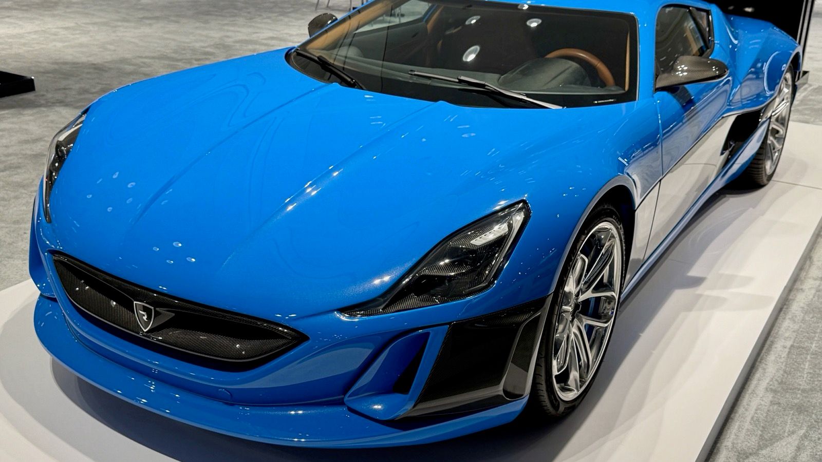 Blue Rimac Concept_One electric coupe on display, front three-quarter view