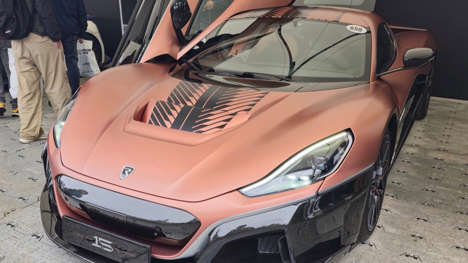2024 Rimac Nevera 15th Anniversary Edition in copper, door raised, front three-quarter view