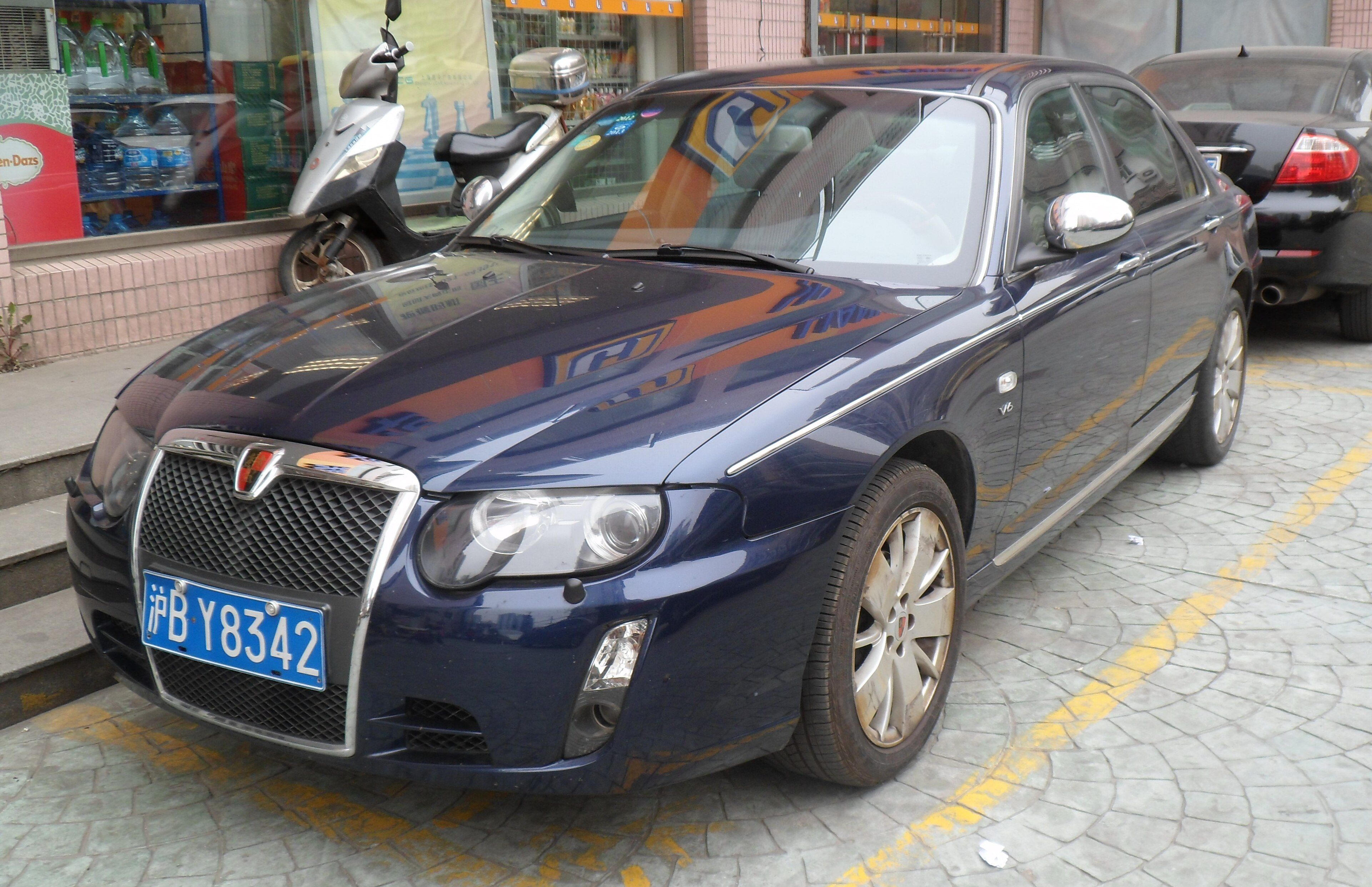Dark blue Roewe 750 V6 sedan parked on a Shanghai street, front three-quarter view