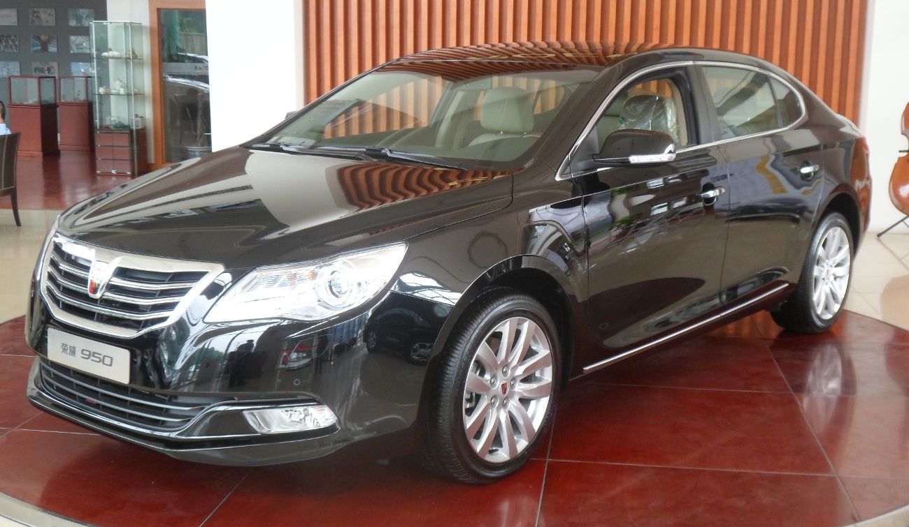 Black Roewe 950 executive sedan on a Chinese dealership turntable, front three-quarter view
