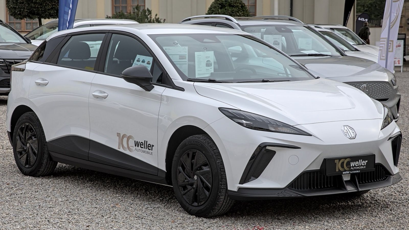White first-generation MG4 EV electric hatchback, front three-quarter view