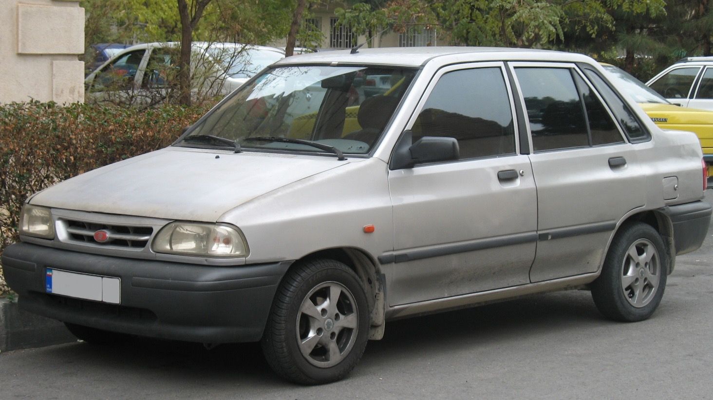 Silver 2013 SAIPA Pride 131 SE four-door sedan in Tehran, front three-quarter view