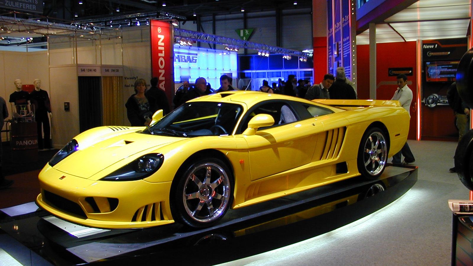 Yellow Saleen S7 on a show stand at the 2004 Geneva Motor Show, front three-quarter view