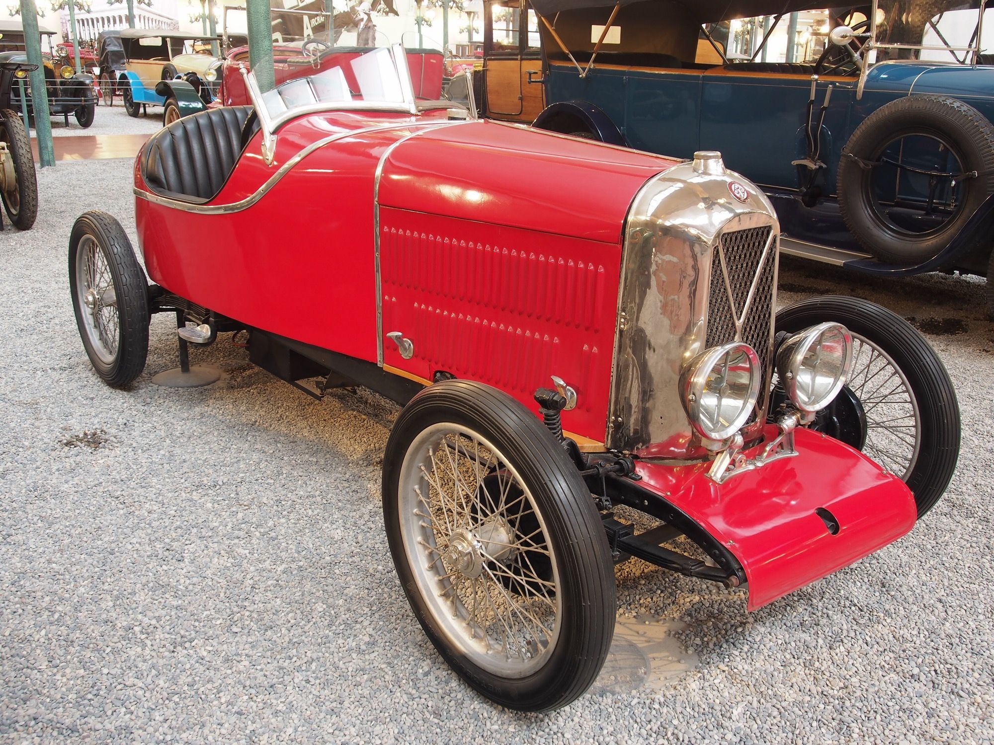Red 1928 Salmson Sport Val 3 twin-cam sports two-seater in a museum, front three-quarter view