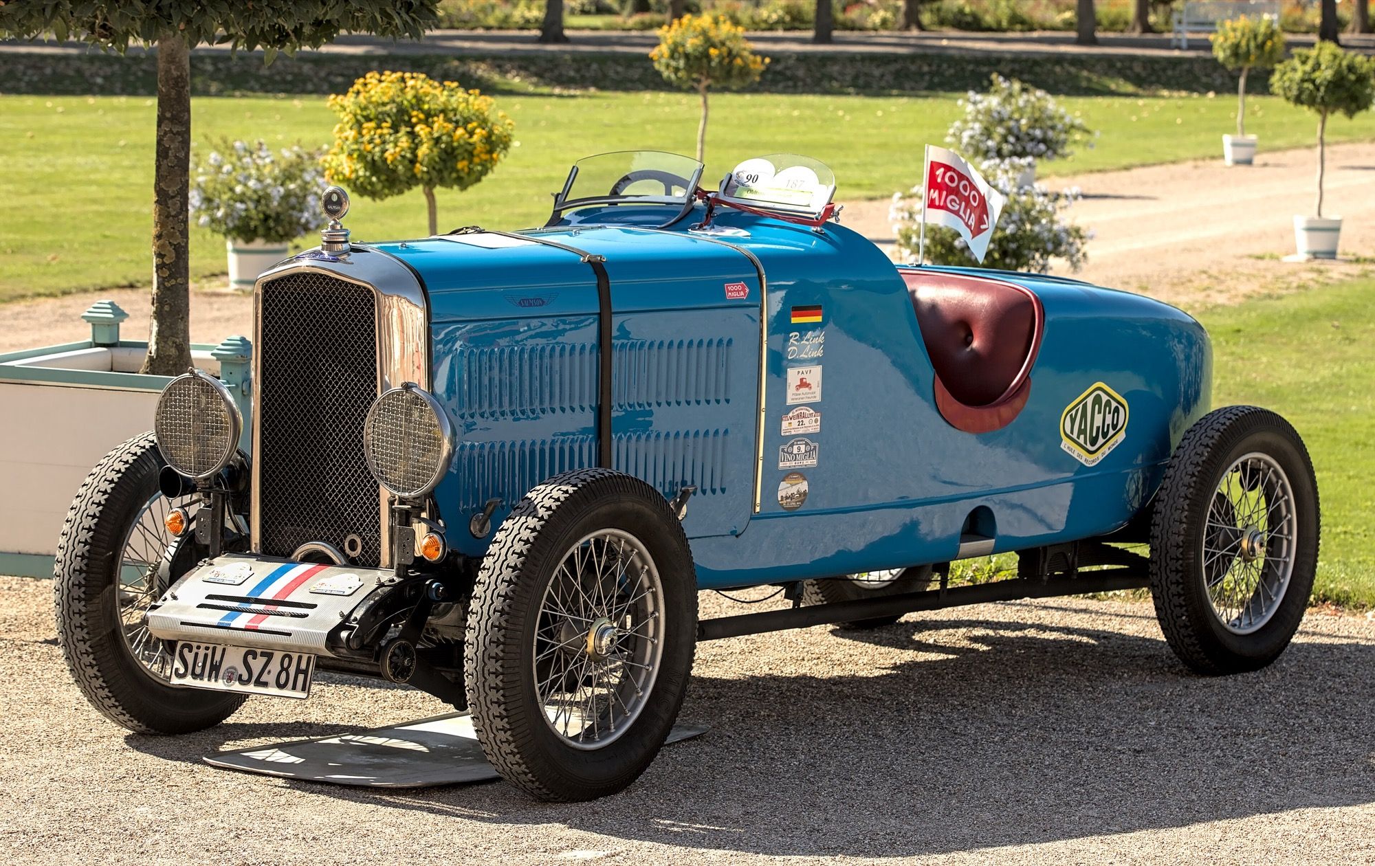 Blue 1930 Salmson S4 with sports roadster body at a concours, front three-quarter view