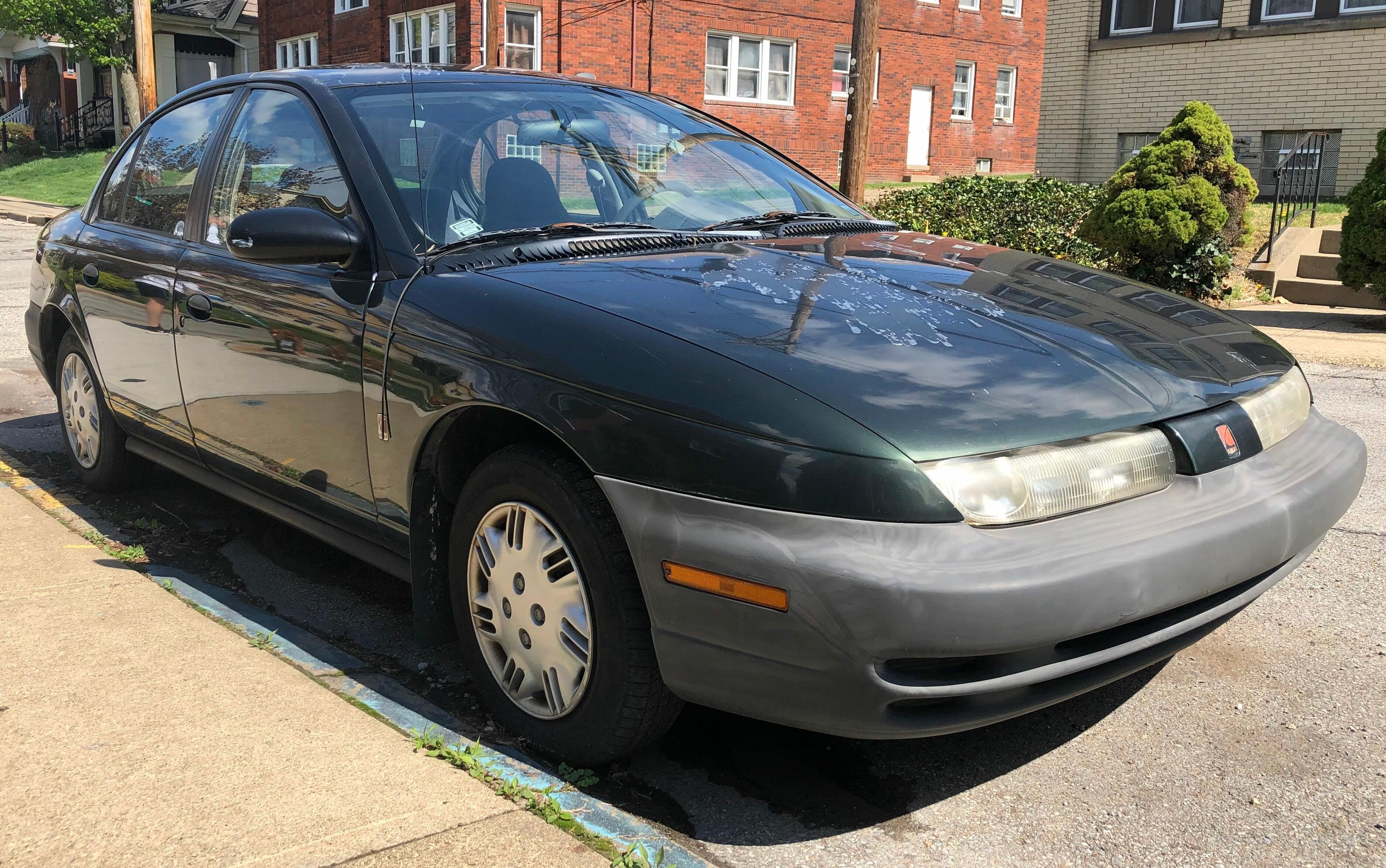 1997 Saturn SL1 sedan, front right view