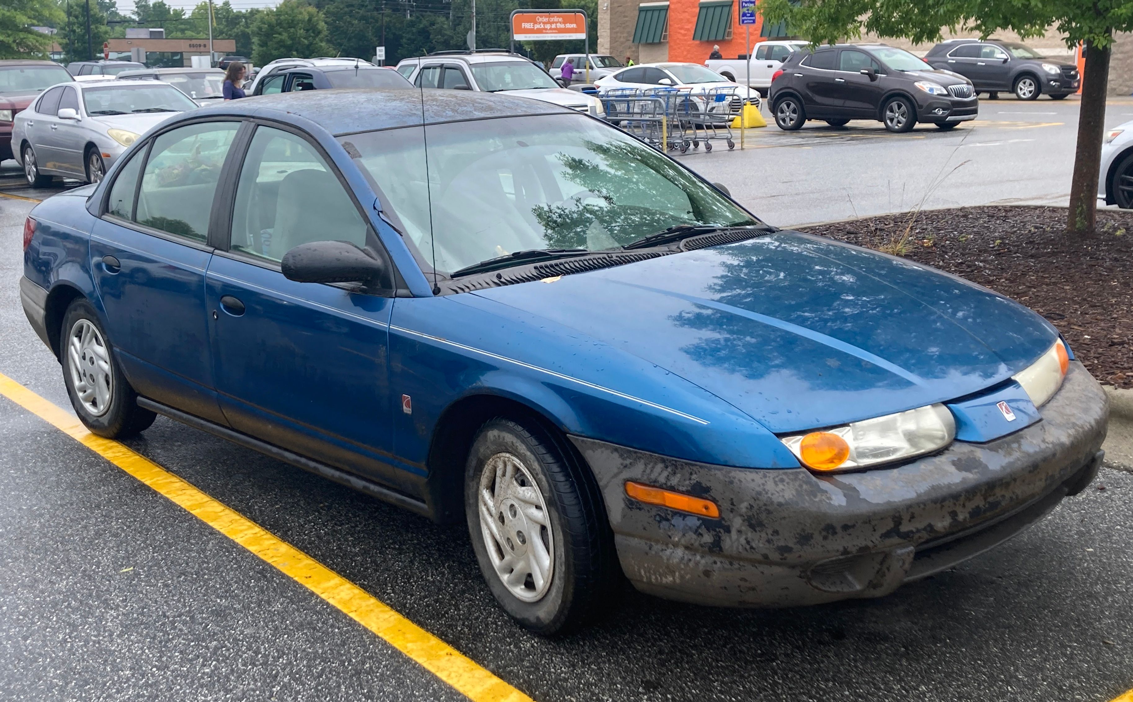 2000 Saturn SL sedan in blue, front right view